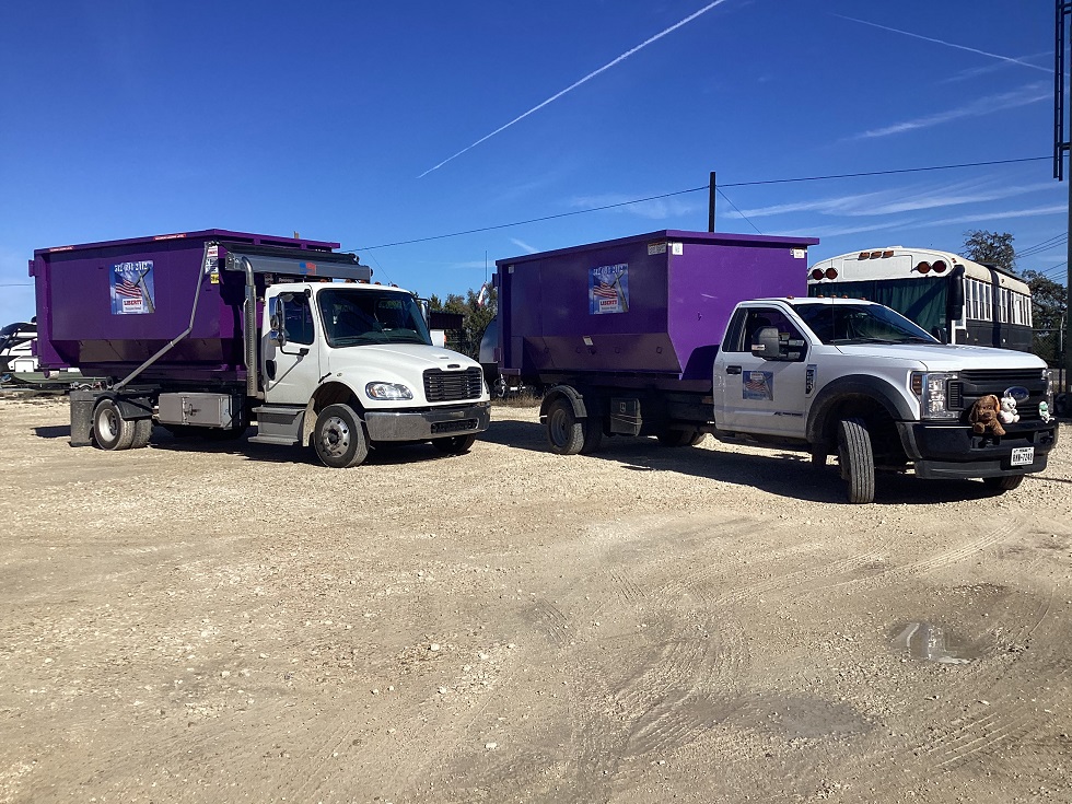 Two purple Liberty dumpsters delivered to a home in Liberty Hill, TX